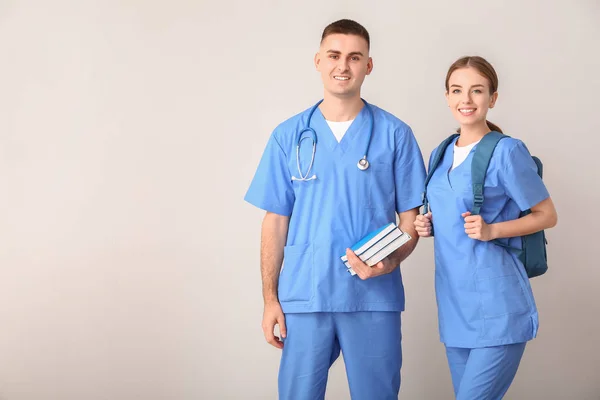 Medical students on light background — Stockfoto