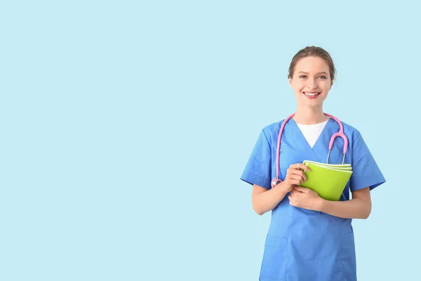 Female medical student on color background — 스톡 사진