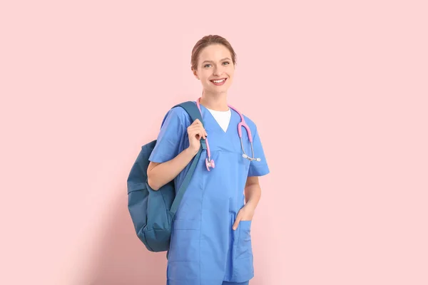 Female medical student on color background — Stockfoto