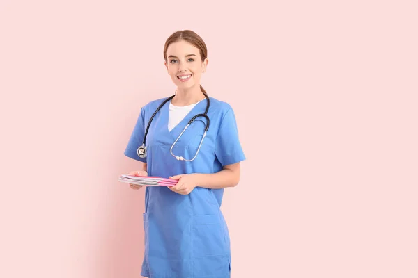 Female medical student on color background — Stock Photo, Image