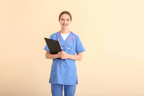 Female medical student on light background — 스톡 사진