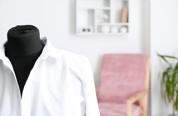 Female mannequin with shirt in atelier, closeup