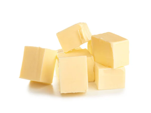 Trozos de mantequilla fresca sobre fondo blanco —  Fotos de Stock
