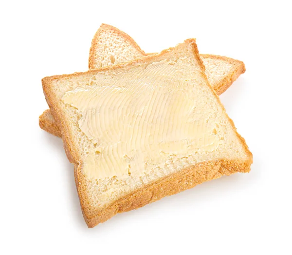 Slices of bread with butter on white background — Stock Photo, Image