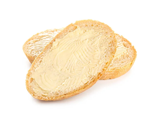 Slices of bread with butter on white background — Stock Photo, Image