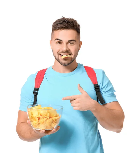 Guapo estudiante masculino con sabrosas papas fritas sobre fondo blanco —  Fotos de Stock