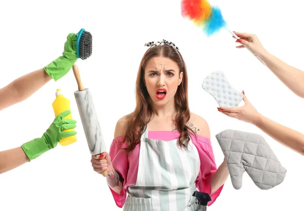 Funny housewife and hands with different items on white background — Stock Photo, Image