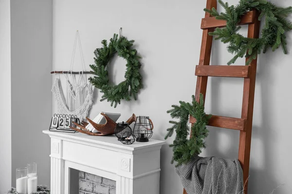 Fireplace with Christmas decor in stylish living room — Stock Photo, Image