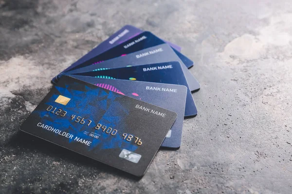 Different credit cards on dark background — Stock Photo, Image