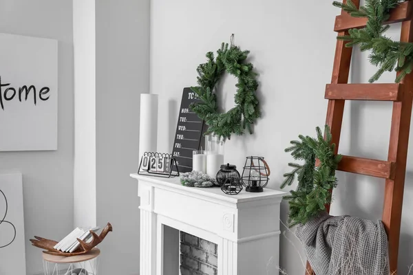 Fireplace with Christmas decor in stylish living room — 스톡 사진