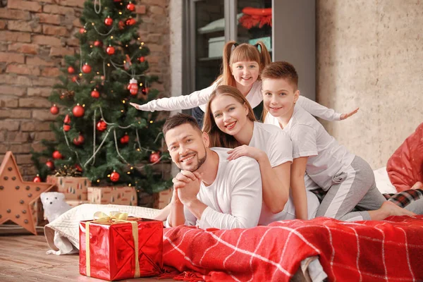 Happy family on Christmas eve at home — Stock Photo, Image