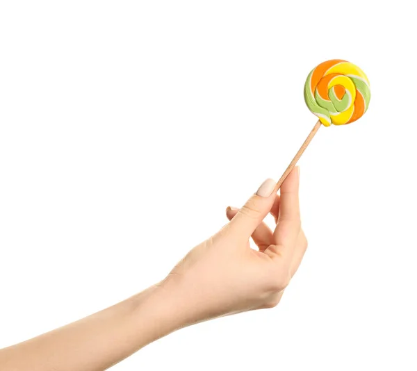 Female hand with sweet lollipop on white background — Stock Photo, Image
