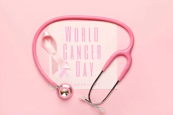 ピンクリボン、聴診器とテキストと紙シート｜World Cancer Day on color background — ストック写真