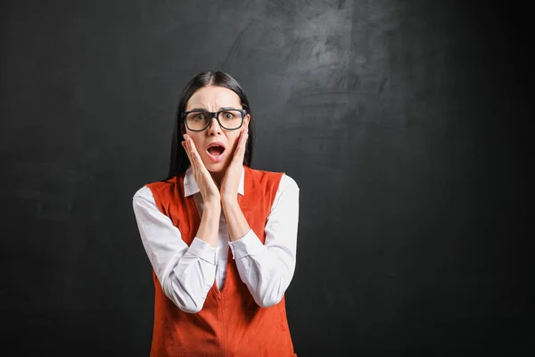 Stressed female teacher near blackboard in classroom — Stock Photo, Image