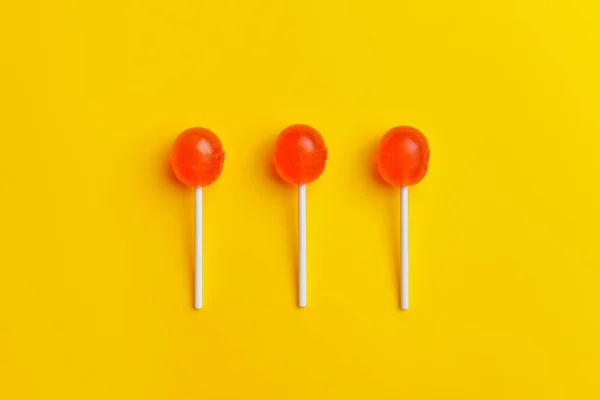 Tasty lollipops on color background — Stock Photo, Image