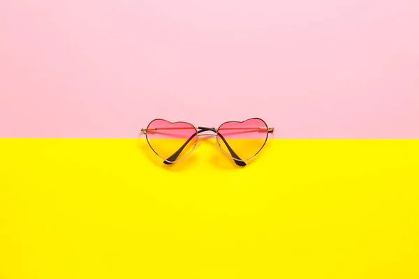 Stylish sunglasses on color background — Stock Photo, Image