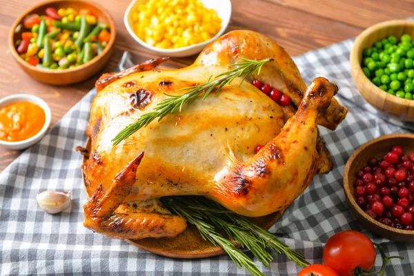 Tasty baked turkey and different food for Thanksgiving day on table — Stock Photo, Image