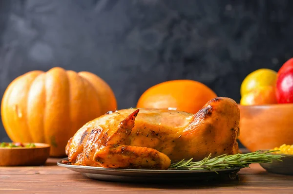 Tasty baked turkey and different food for Thanksgiving day on table — Stock Photo, Image