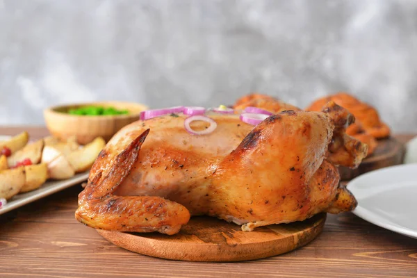 Tasty baked turkey for Thanksgiving day on table