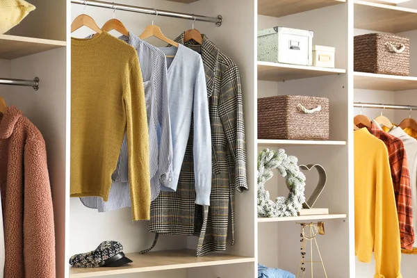 Modern wardrobe with stylish winter clothes and accessories — Stok fotoğraf