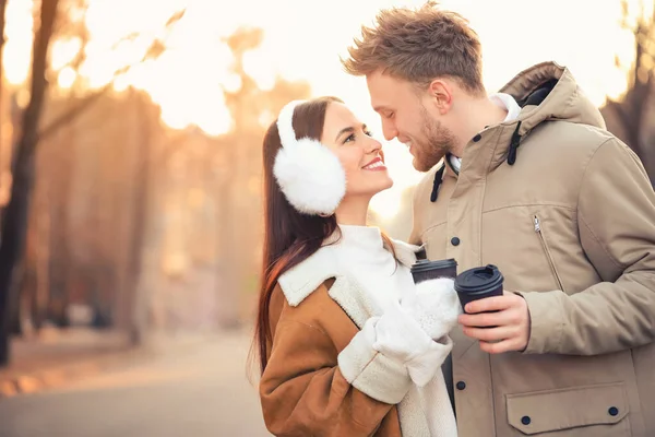 Happy young couple walking outdoors on winter day — Stock Photo, Image