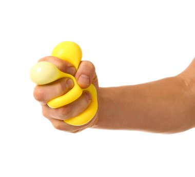 Hand squeezing stress ball on white background