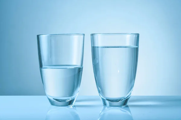 Glasses of fresh water on color background — Stock Photo, Image