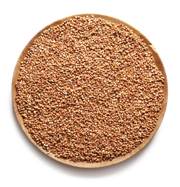 Cuenco con trigo sarraceno crudo sobre fondo blanco —  Fotos de Stock