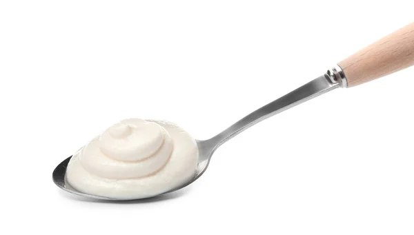 Spoon with tasty cream cheese on white background — Stock Photo, Image