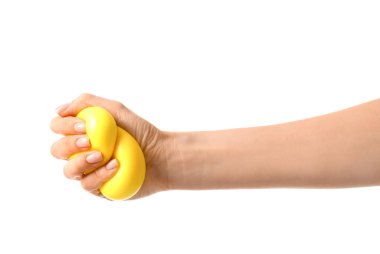 Hand squeezing stress ball on white background