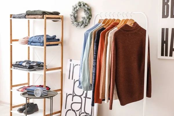 Interior of modern dressing room with winter clothes — Stockfoto