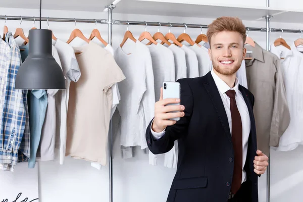 Stylish young man taking selfie in dressing room — 스톡 사진