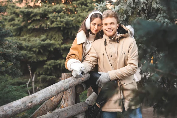 Happy young couple walking outdoors on winter day — Stock Photo, Image