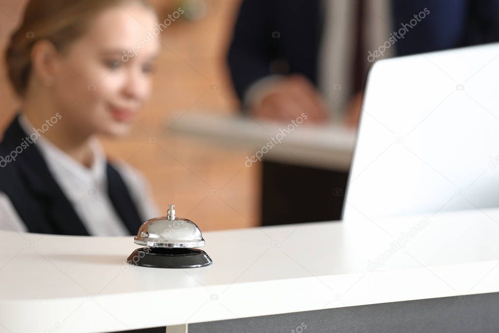 Service bell on reception desk in hotel