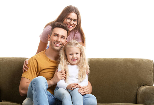 Happy young family sitting with sofa on white background