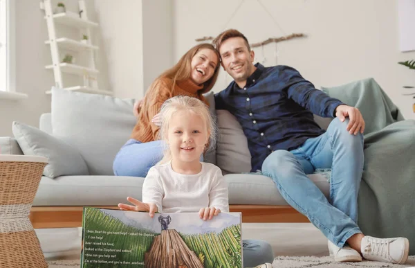 Cute little girl with parents resting at home — Stock Photo, Image