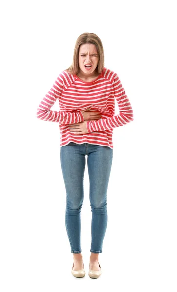 Young woman suffering from stomachache on white background — Stock Photo, Image