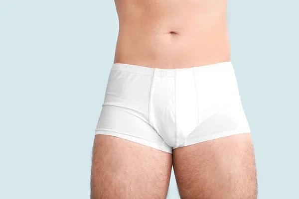 Young man in underwear on light background — Stock Photo, Image
