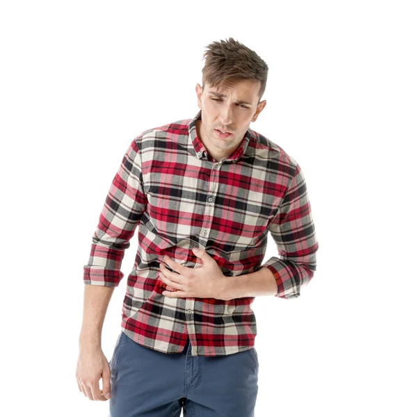 Young man suffering from abdominal pain on white background — Stock Photo, Image