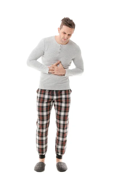 Hombre joven que sufre de dolor abdominal sobre fondo blanco —  Fotos de Stock
