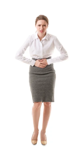 Joven mujer de negocios que sufre de dolor abdominal sobre fondo blanco — Foto de Stock
