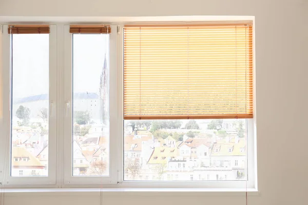 Modern blinds hanging on window — Stock Photo, Image
