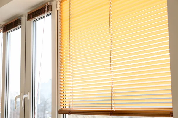 Modern blinds hanging on window — Stock Photo, Image