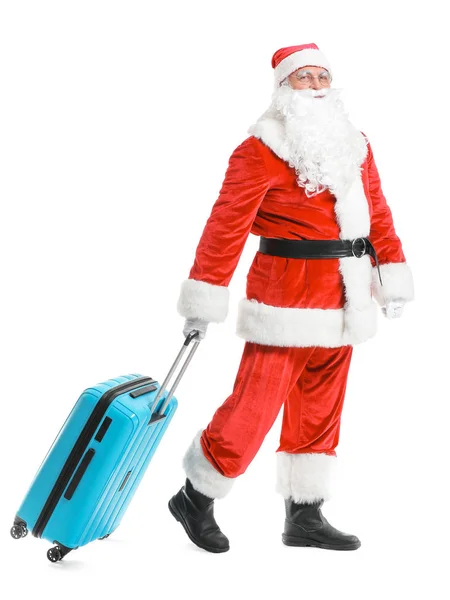 Санта-Клаус с багажом на белом фоне. Концепция отпуска — стоковое фото