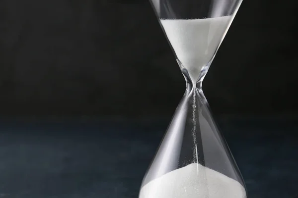 Hourglass on dark background. Time management concept — Stock Photo, Image