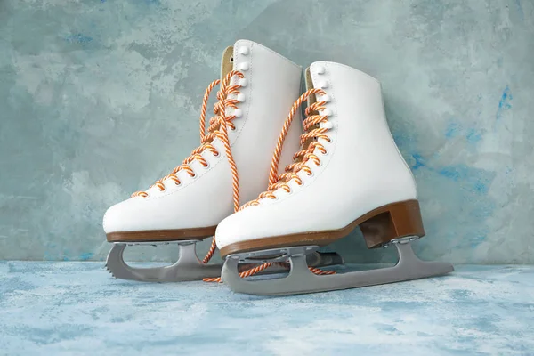 Ice skate shoes on color background — Stock Photo, Image