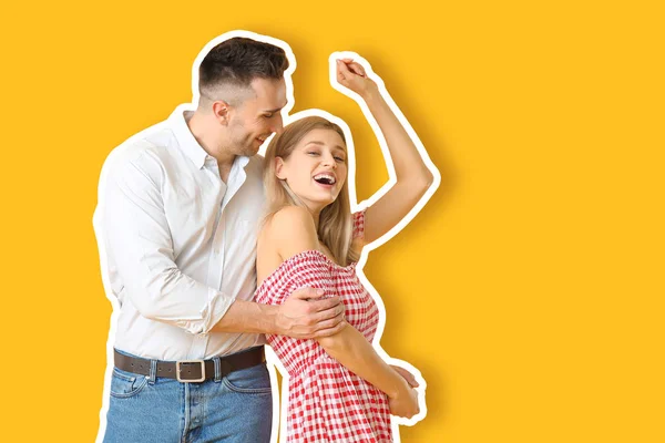 Happy dancing young couple on color background — 스톡 사진