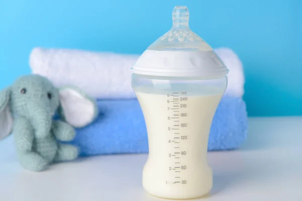 Bottle of milk for baby on table — Stock Photo, Image