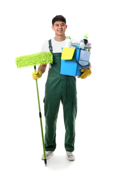 Asian janitor with cleaning supplies on white background — Stock Photo, Image