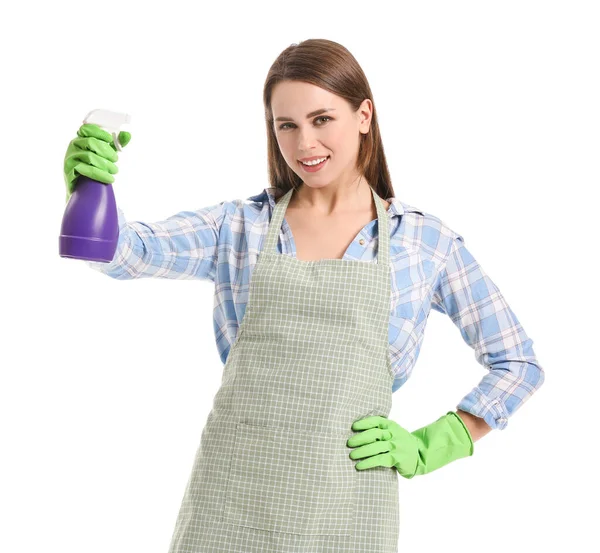 Jovem dona de casa com detergente no fundo branco — Fotografia de Stock